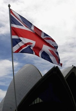 SYDNEY, AUSTRALIA - MARCH 13: The Union flag flies in anticipation of the arrival of Her Majesty Queen Elizabeth II at the Sydney Opera House on March 13, 2006 in Sydney Australia. The Queen and Prince Philip are on a five-day visit to Australia where she will officially open the Commonwealth Games in Melbourne. (Photo by Paul Miller/Getty Images)